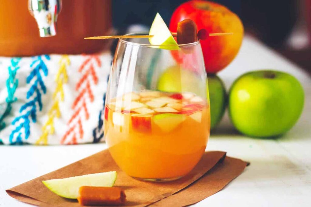 caramel apple sangria glass - Tasty Thanksgiving punch recipe non-alcoholic and alcoholic to feed a crowd. Press Print Party
