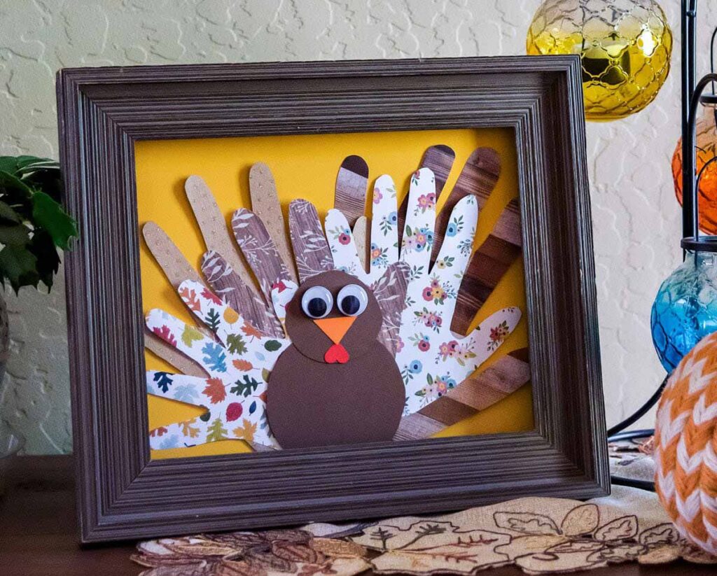 family hand prints in frame turkey - 45 Turkey crafts ideas for kids - Press Print Party!