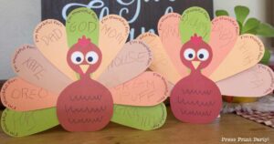 Free thankful turkey printable craft template for kids - 2 colorful printable turkeys on table - Press Print Party!