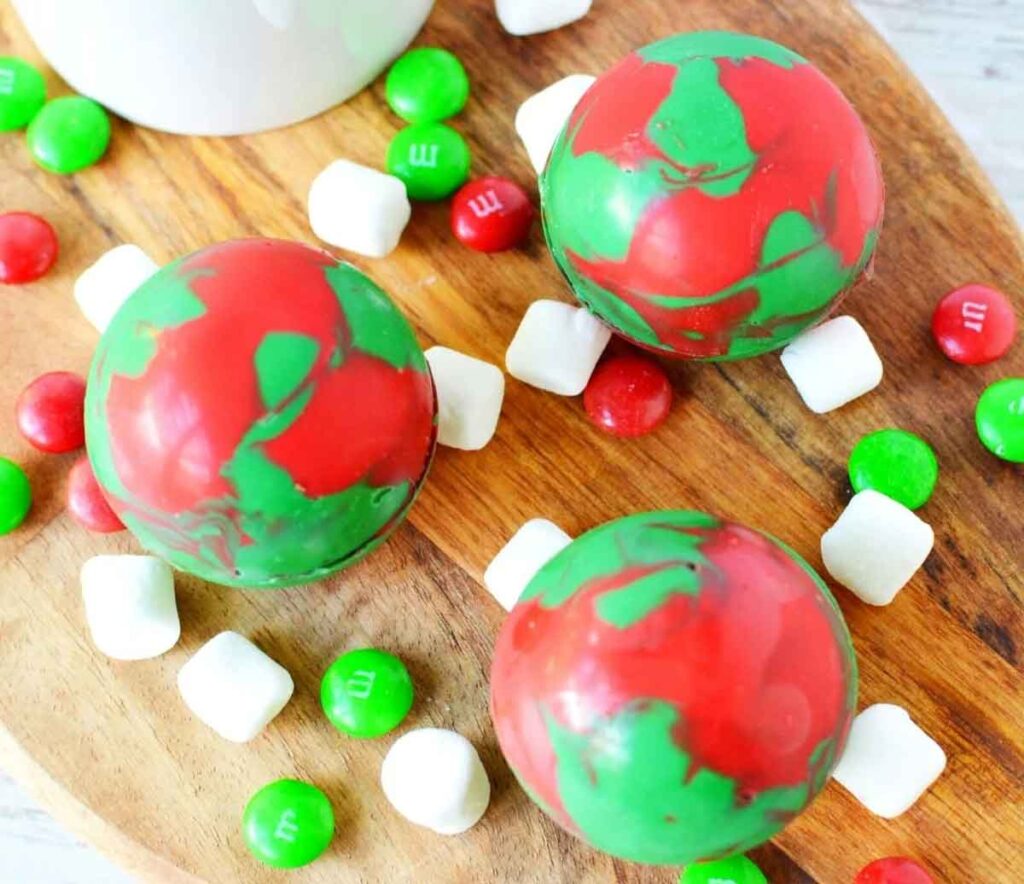 red and green hot chocolate bombs - 10 unique Christmas hot cocoa bombs - Press Print Party!