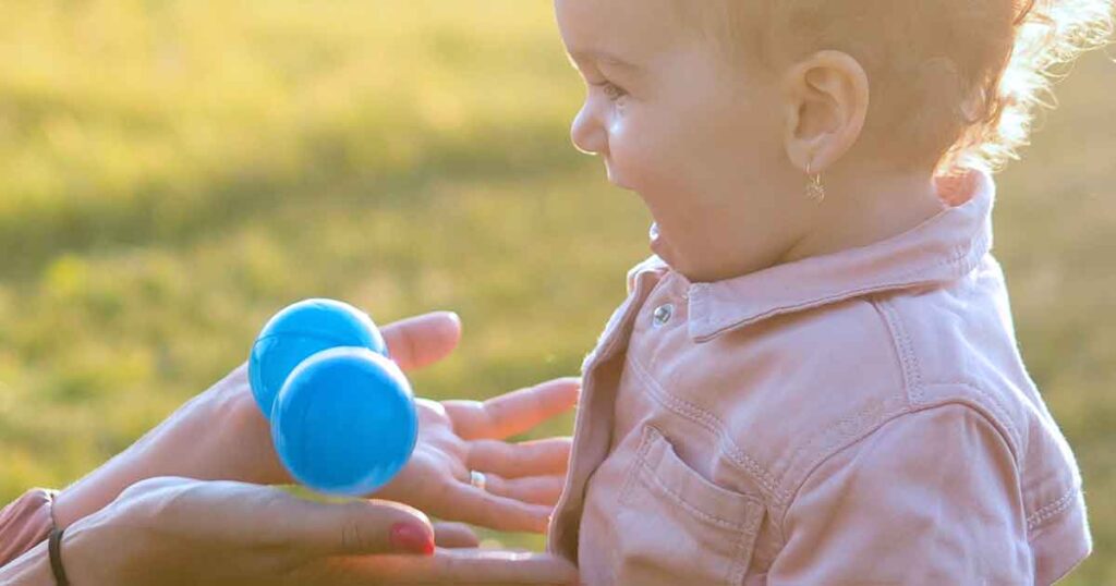 throwing balls - 15 fun birthday party activities for toddlers and young kids - Press Print Party!