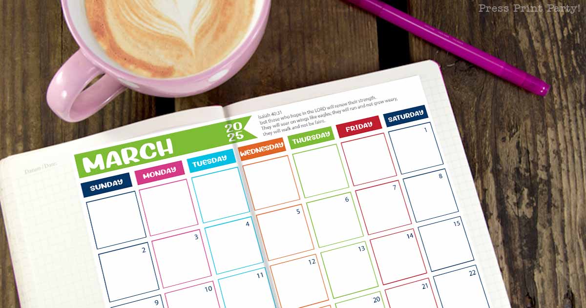 A blank March 2025 calendar for bullet journaling is spread open on a wooden table, featuring colorful borders for each day. A pink coffee mug with latte art and a purple pen sit stylishly beside the calendar.