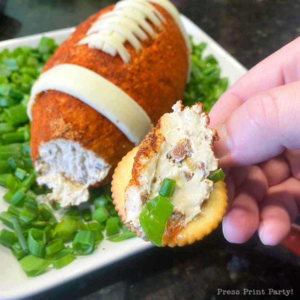 football cheese ball on bed of onions - football shaped cheese ball - cheese footballs - Press Print Party!