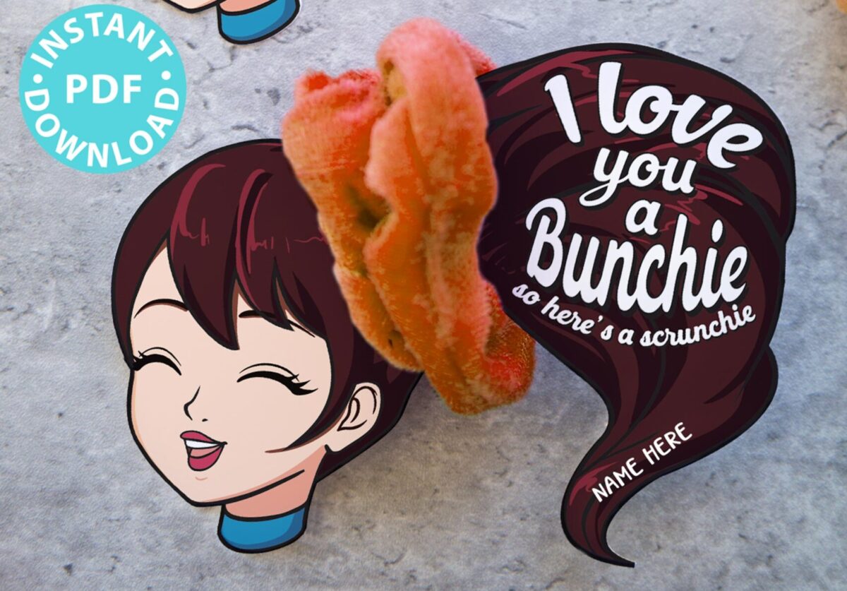 Two illustrated cards featuring a smiling girl with a large ponytail, holding a scrunchie. Text reads "I love you a bunchie, so here's a scrunchie." Personalize the name and enjoy these delightful pun-filled gifts. Scrunchies are attached to each card.