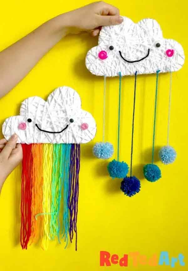 yarn wrapped cloud rainbows pom poms - 25 cool rainbow crafts for kids and art ideas - Press Print Party!