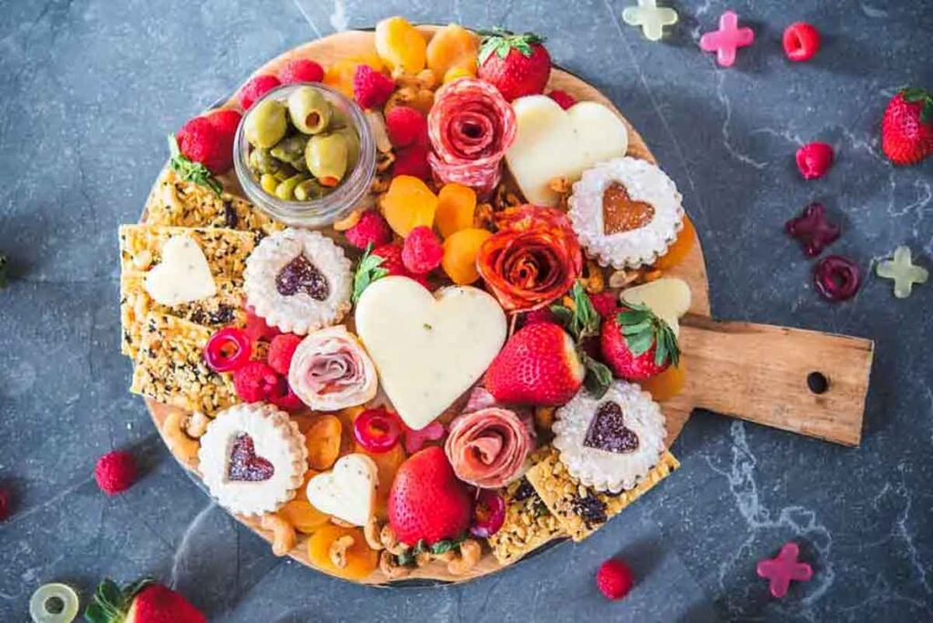 Cheerful Valentine’s Day Charcuterie Board by Cuisine And Travel - 20 Valentine Charcuterie Boards: Ideas and Inspiration