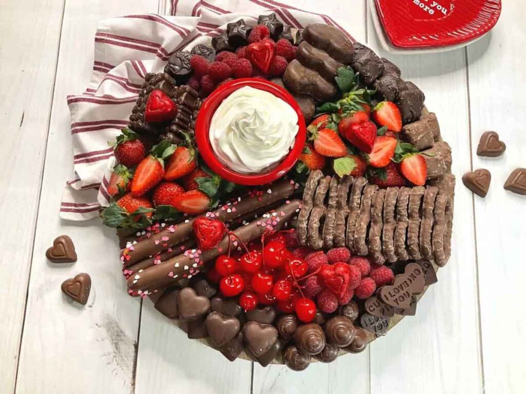 Calling all chocolate lovers! This Valentine’s Day board is for you! With all the best chocolate, fruit, and whipped cream for dipping! This is the perfect date night treat for you and your special Valentine. - 20 Valentine Charcuterie Boards: Ideas and Inspiration