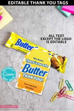 A Butterfinger Candy Bar Thank You Printable Gift Tag saying, "Mrs. Brown, There's no one Butterfinger candy than you! You're the best! From Kate," rests beside a Butterfinger bar with colorful paper clips and a pink stamp in the scene.