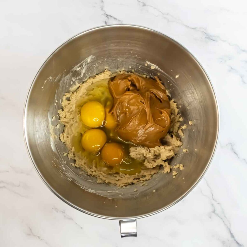 stand up mixer bowl with ingredients for cake batter inside
