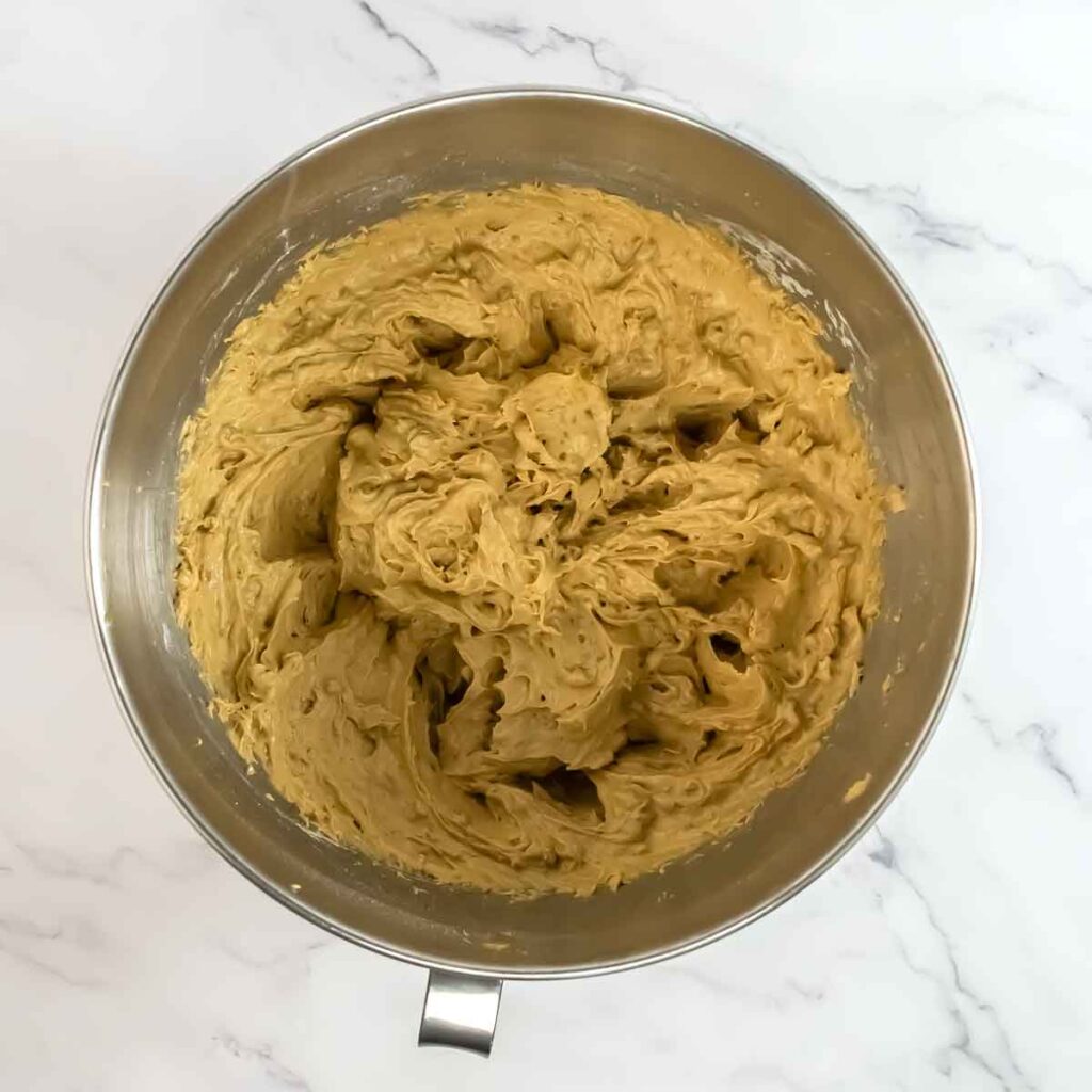 stand up mixer bowl with mixed cake batter inside