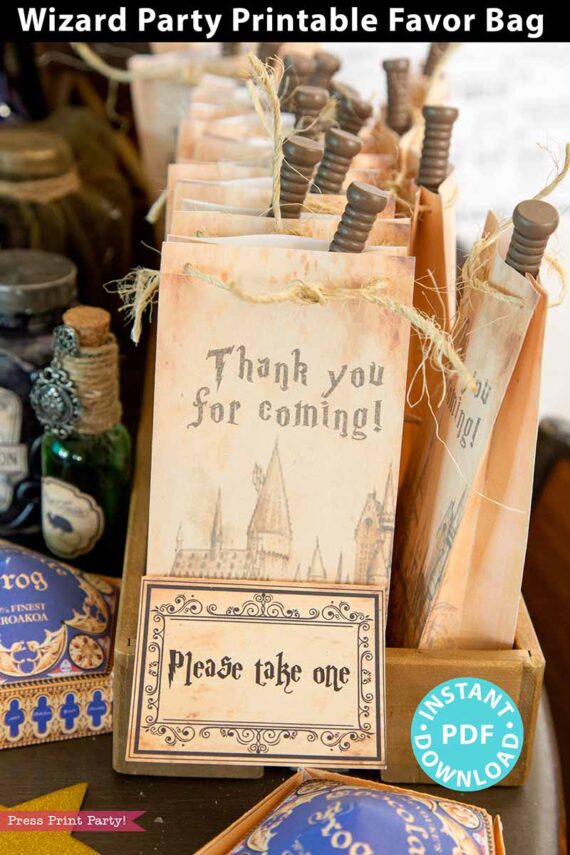 loot bag for wizard party on table with please take one sign