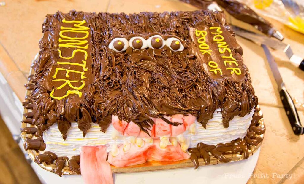 finished monster book of monsters cake on kitchen counter- Press Print Party