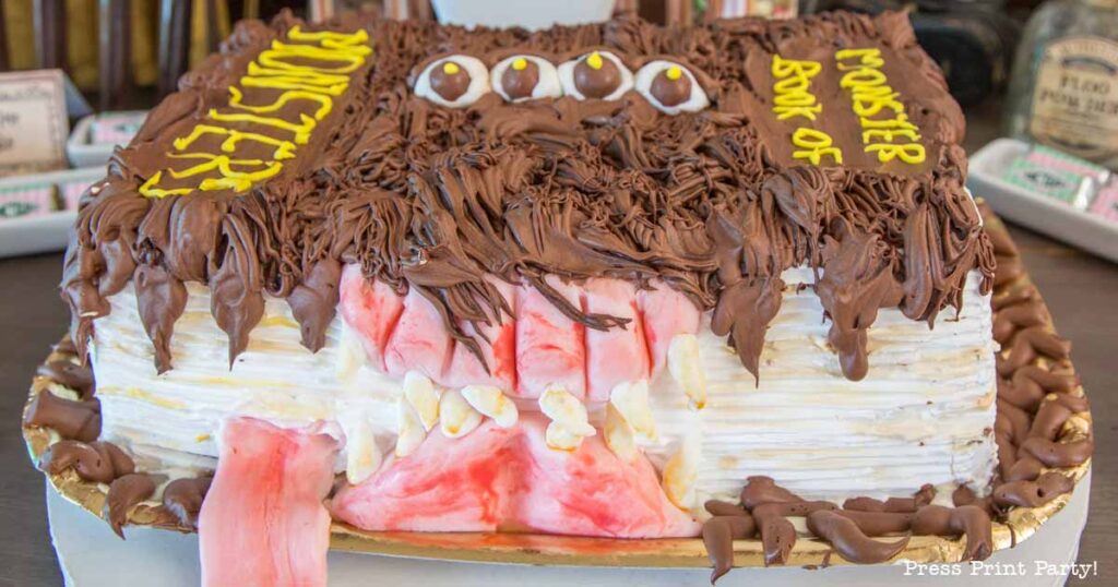 finished monster book of monsters cake on table - Press Print