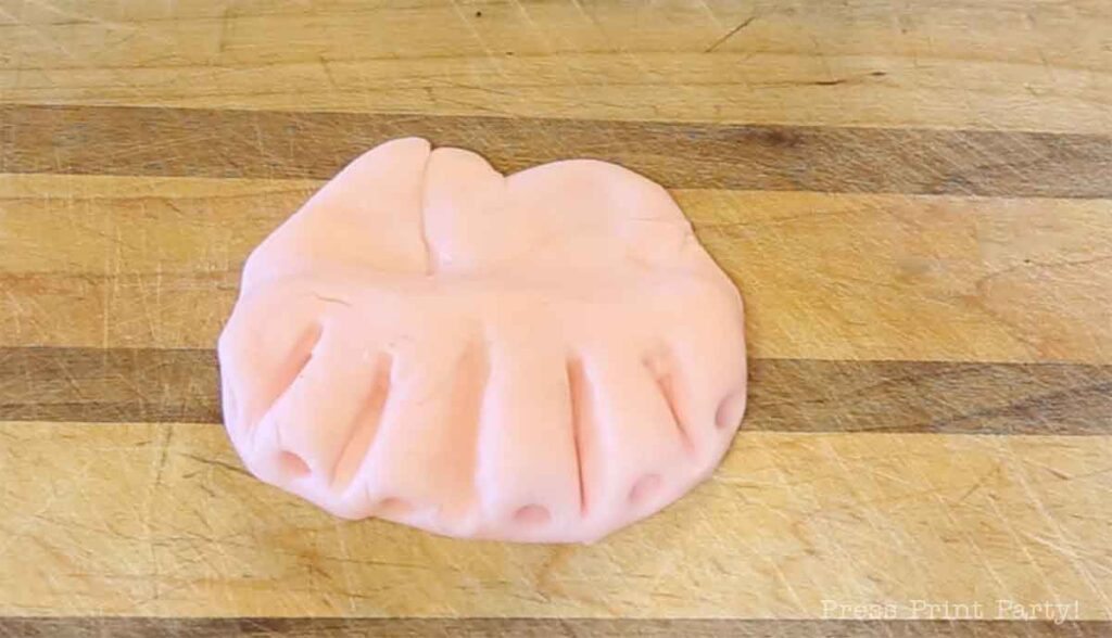 top gums for the monster book of monsters cake on table - Press Print