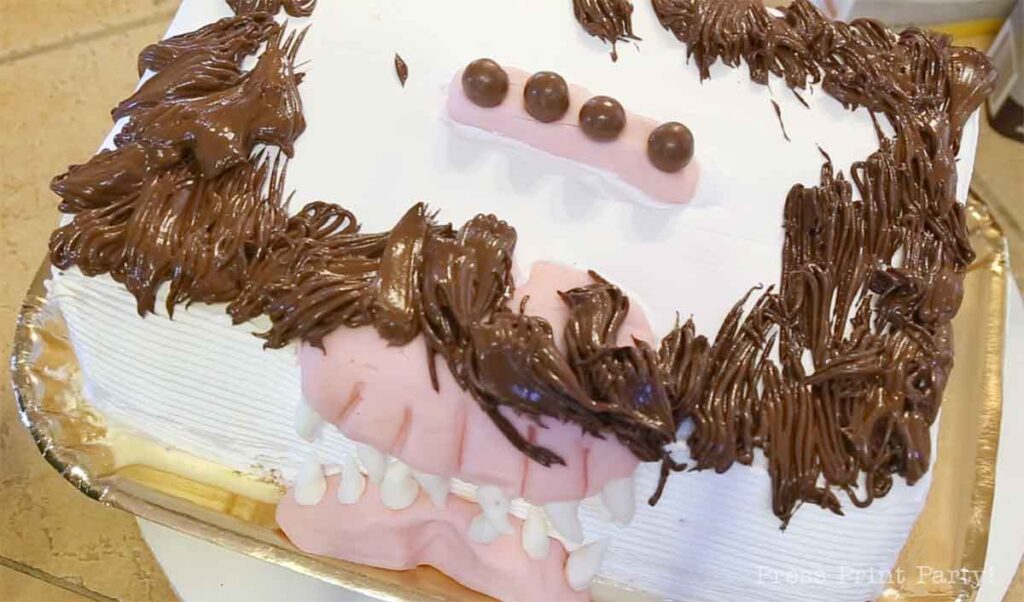 getting the buttercream fur on the monster book of monsters cake on table - Press Print