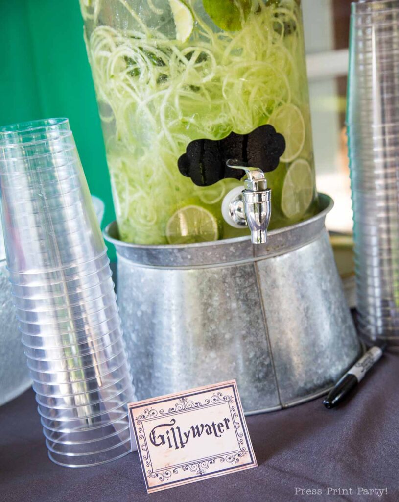 Gillyweed water for harry potter party with cucumbers lime and mint.
