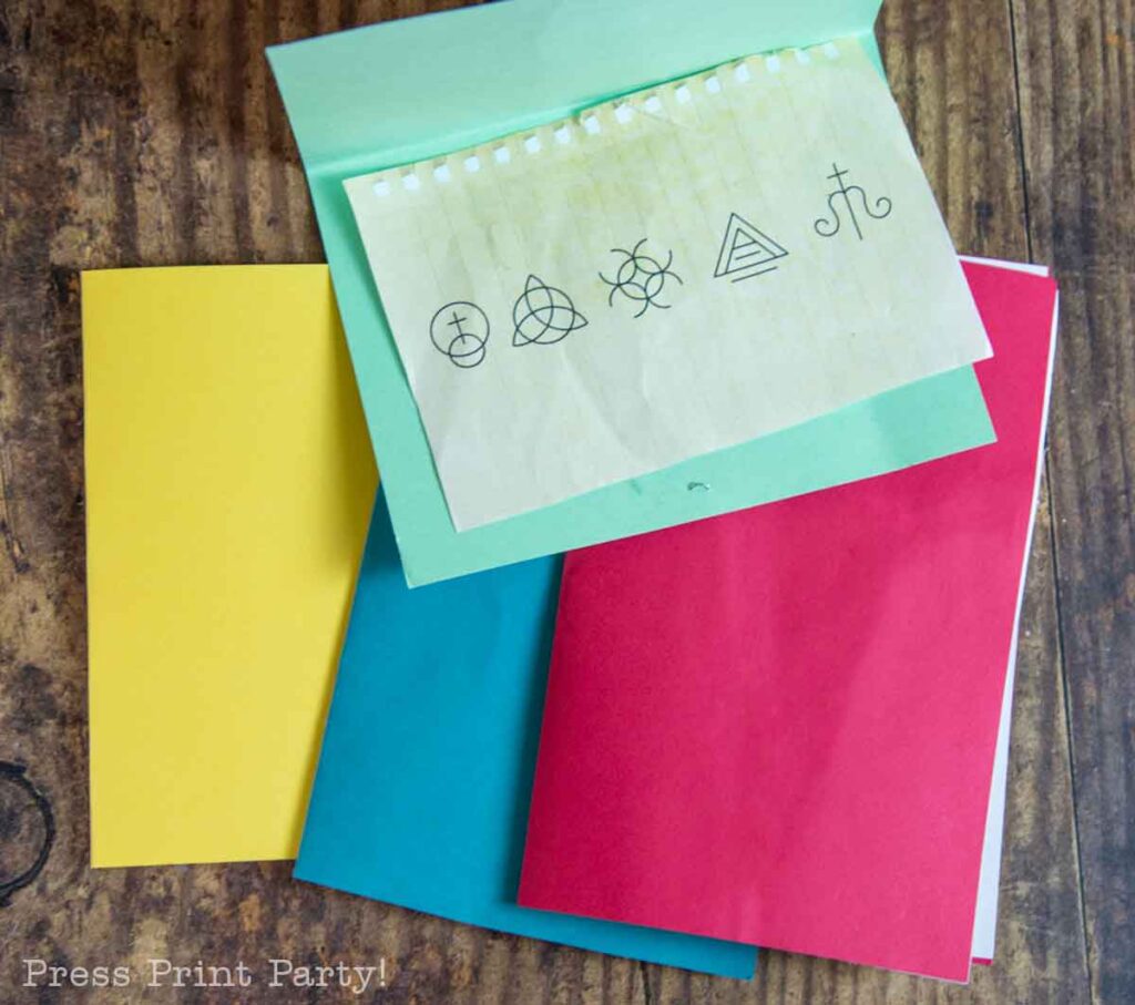 colored paper with encrypted text inside for scavenger hunt