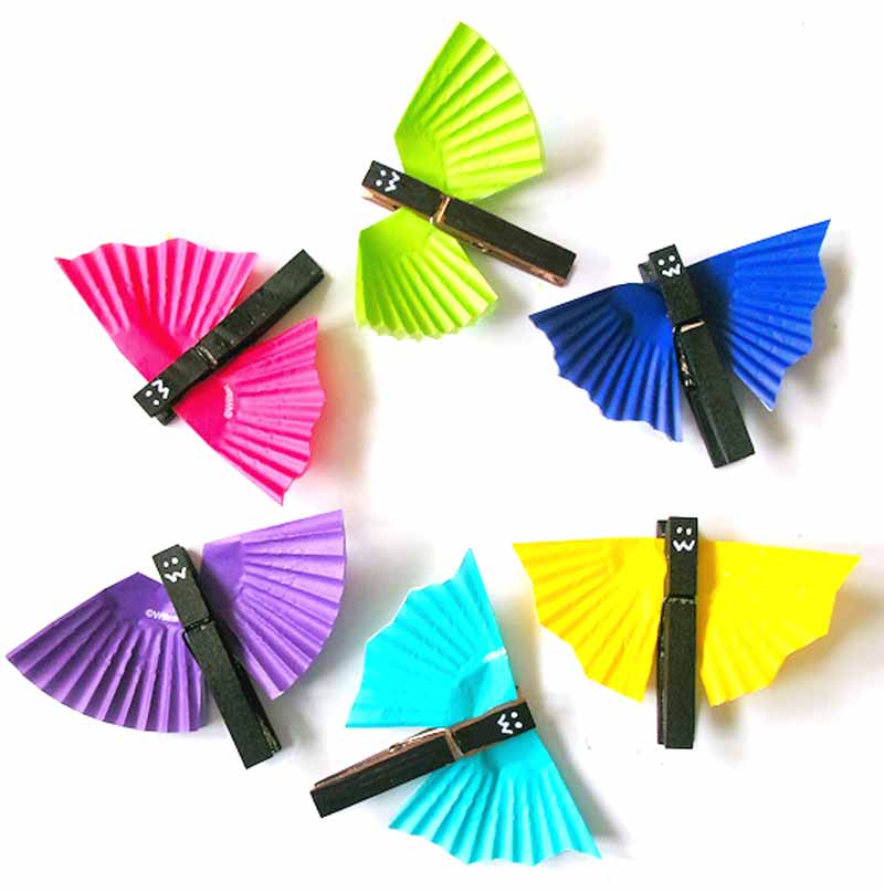 clothespins with cupcake liners attached to them to look like bats