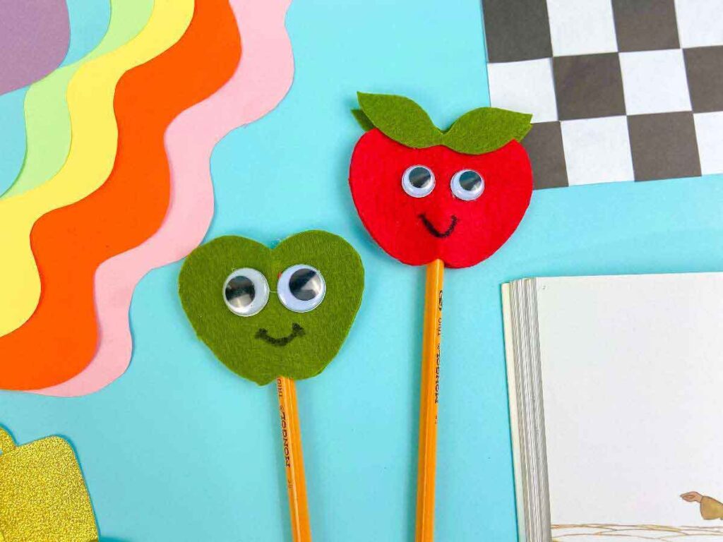 felt pencil topper in apple shape with googly eyes.