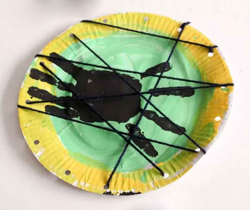 paper plate handprint spider and web lacing