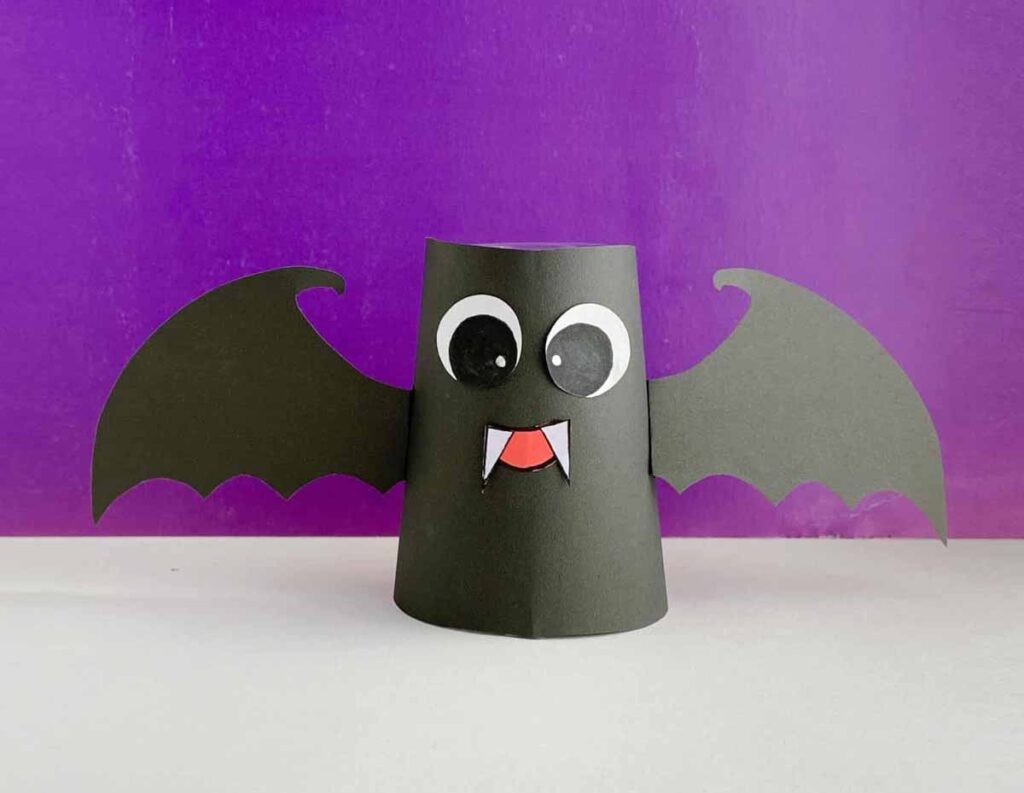 a black cup bat craft on a purple background