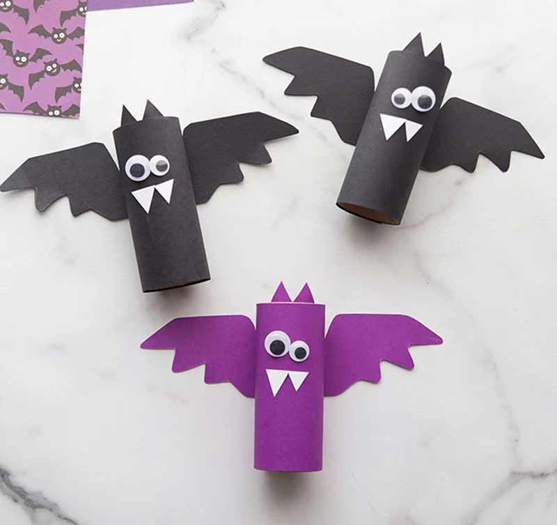a group of bats made out of toilet paper roll