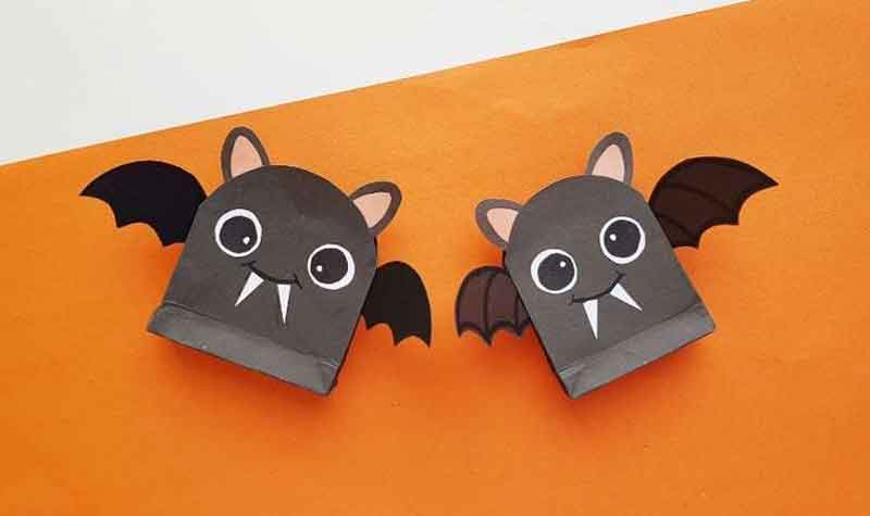2 paper bag bats on orange background