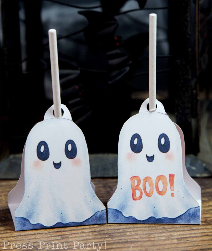 2 ghosts with lollipop stick