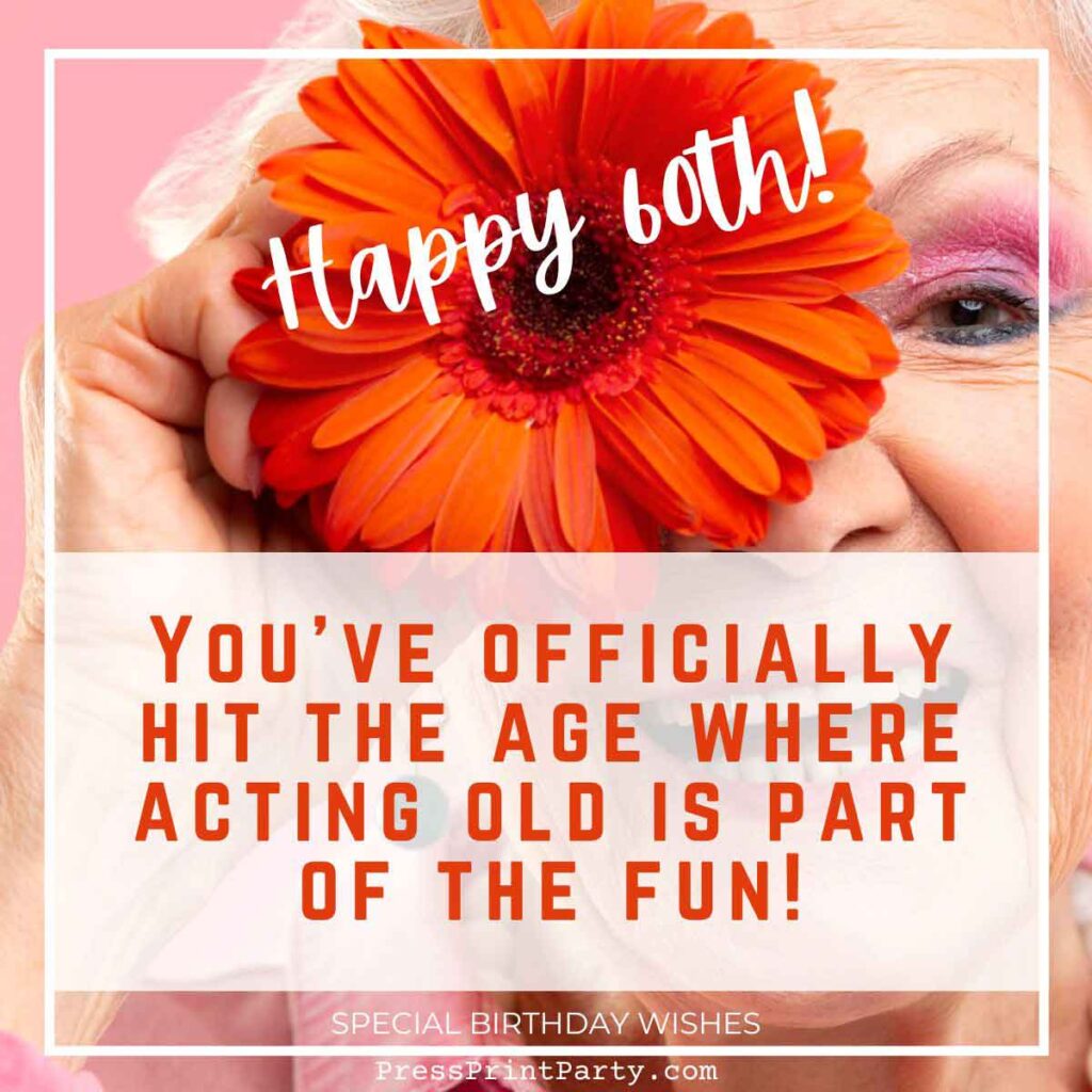 A cheerful woman holds an orange flower over one eye, smiling widely. The text on the image reads, "Happy 60th! You've officially hit the age where acting old is part of the fun! Sending special birthday wishes your way for a day as vibrant as your smile!
