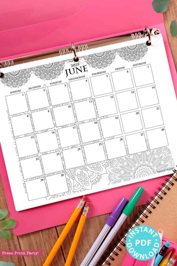 A decorative June 2025 calendar page is placed on a pink clipboard, surrounded by colorful pencils, a spiral notebook, and some green leaves. The calendar features intricate floral patterns at the top and bottom that reflect the elegance of a meticulously designed "2025 One Page Calendar at-a-glance Printable Mandala.