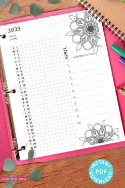 A 2025 One Page Calendar at-a-glance Printable Mandala open to April showcases a single-page calendar highlighted with red-emphasized weekends amidst floral designs. The monthly goals section is designed to inspire creativity, adorned with leaves and vibrant markers, accompanied by a sticker that reads 