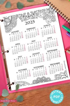 A 2025 One Page Calendar at-a-glance Printable Mandala is displayed on a pink background, alongside colorful pens. Each month features Sundays highlighted in pink, and a blue sticker announces 