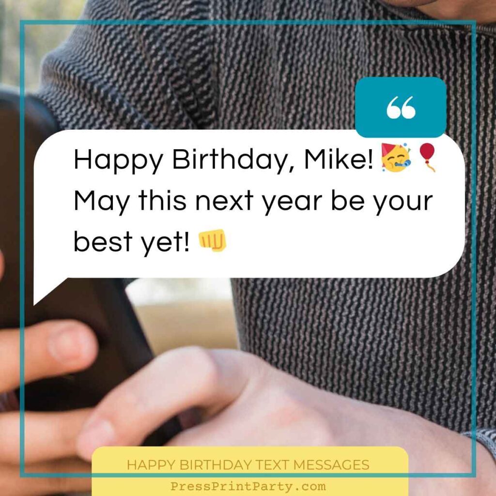 Close-up of a person holding a phone showing a happy birthday text message: "Happy Birthday, Mike! 🎉🎈 May this next year be your best yet! 👊" In the background, their casual outfit can be seen, capturing a moment of celebration and connection.