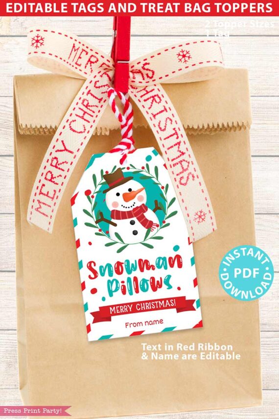 A brown paper gift bag adorned with a red Merry Christmas ribbon and a festive snowman tag, named "Mrs. Claus Bakery Christmas Treat Bag Topper & Tag." The tag includes the phrase "Snowman Pillows, Merry Christmas!" along with options for editable text. An "Instant PDF Download" label is clearly displayed.