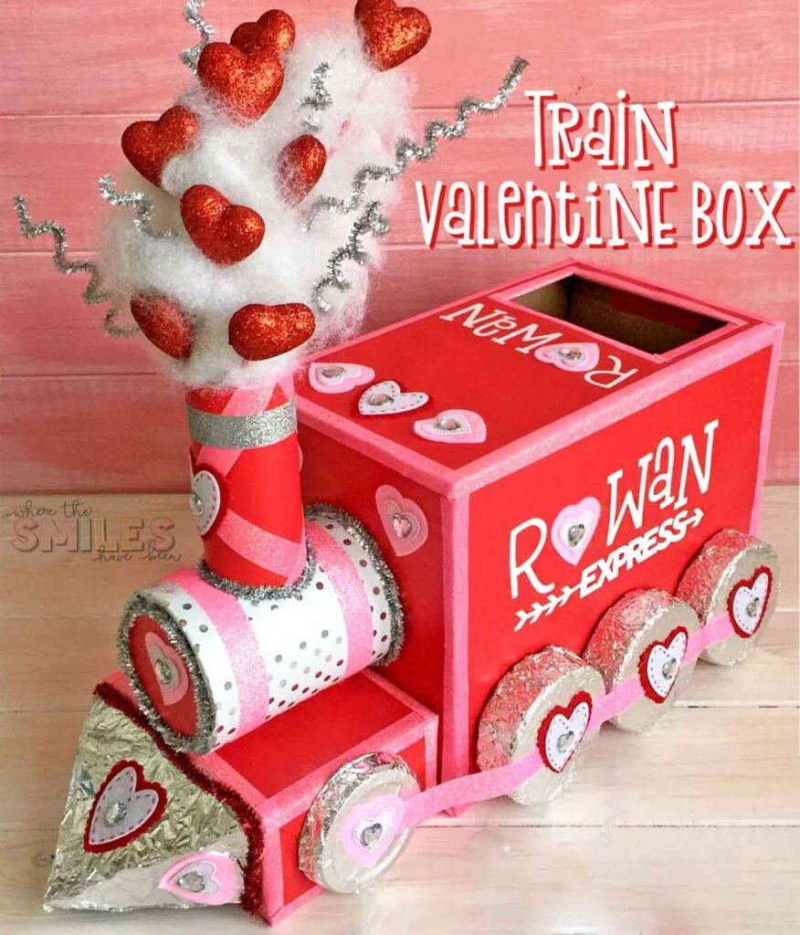 The "Rowan Express," a red and pink train-shaped Valentine box, is perfect for valentine box ideas for school. Adorned with hearts, silver accents, a cotton chimney, and glittery red hearts, it's an enchanting way to deliver love on Valentine's Day.