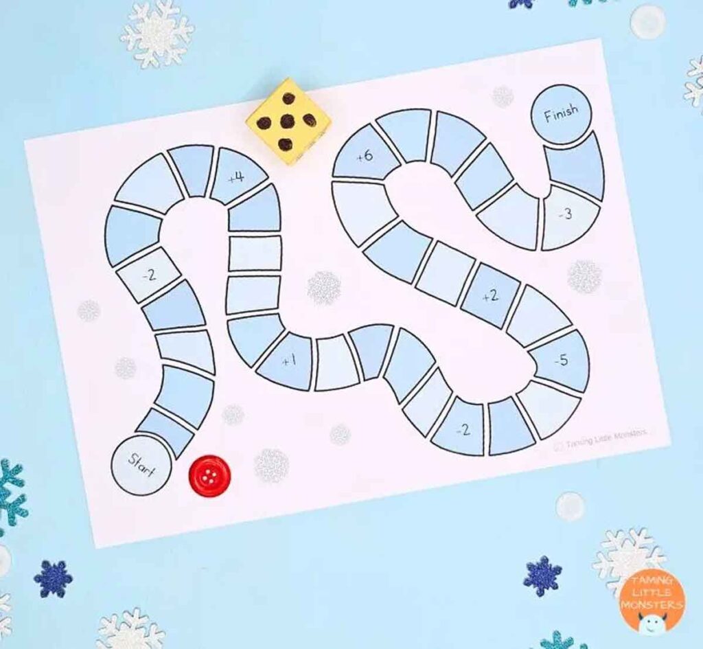 This printable winter game features a winding path of numbered blue spaces, starting at "Start" and ending at "Finish." Snowflakes adorn the background, while a six-sided die and red button are used as game pieces.