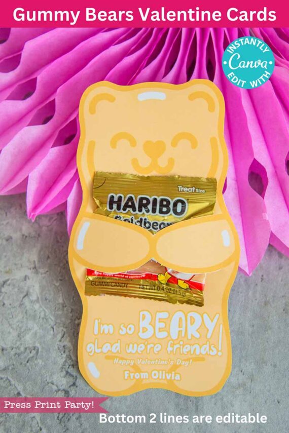 A yellow bear-shaped card, named template (Copy) (Copy), holds two gummy bear packs in its paws. The card says, "I'm so BEARY glad we're friends! Happy Valentine's Day! From Olivia," with pink tissue paper as the backdrop.