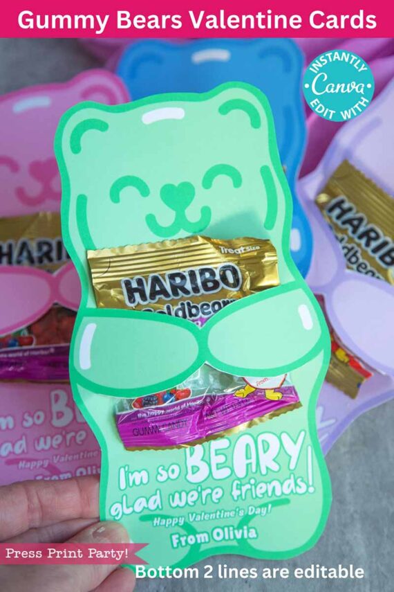 A hand holds a green bear-shaped Valentine card with Haribo gummies inside, reading "I'm so BEARY glad we're friends!" Similar cards are seen in the background with a red banner, "Gummy Bears Valentine Cards." Product Name: template (Copy) (Copy).