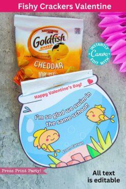 A packet of Goldfish crackers is included with a vibrant fishbowl-shaped Valentine card featuring two cartoon yellow fish and the message, "Happy Valentine's Day! I'm so glad we swim in the same school!.