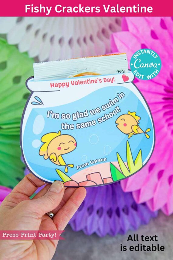 A Valentine's card shows a fishbowl with cartoon fish, plants, and reads "I'm so glad we swim in the same school!" The top says "Happy Valentine's Day!" with space for a name. Colorful paper decorations fill the background. Product name: template (Copy) (Copy).