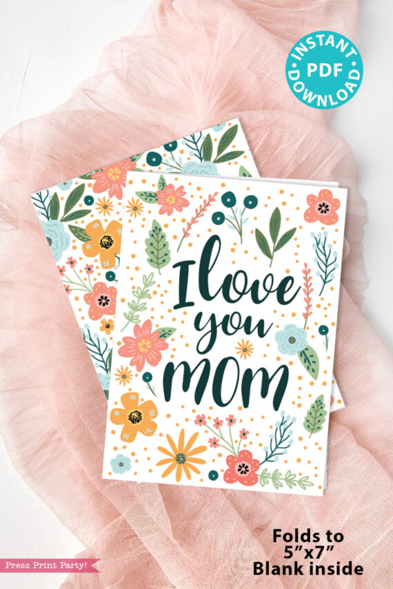 The Floral Mothers Day Card - Whimsy features "I love you MOM" with colorful flowers and leaves on pink fabric. Includes labels: "INSTANT PDF DOWNLOAD" and "Folds to 5” x 7”, Blank inside.