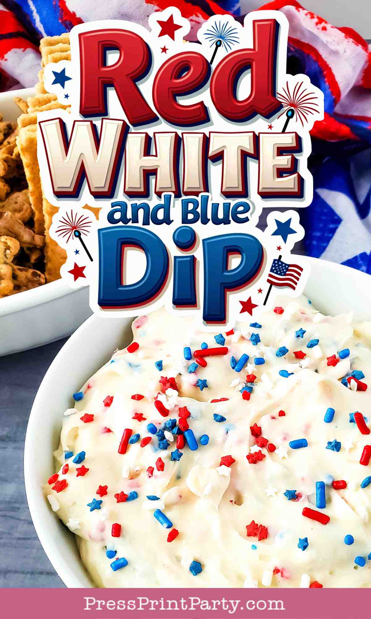A bowl of creamy red white and blue dip topped with festive sprinkles sits in front of a “Red, White and Blue Dip” sign decorated with fireworks. Crackers and a patriotic napkin add flair to the celebration scene.