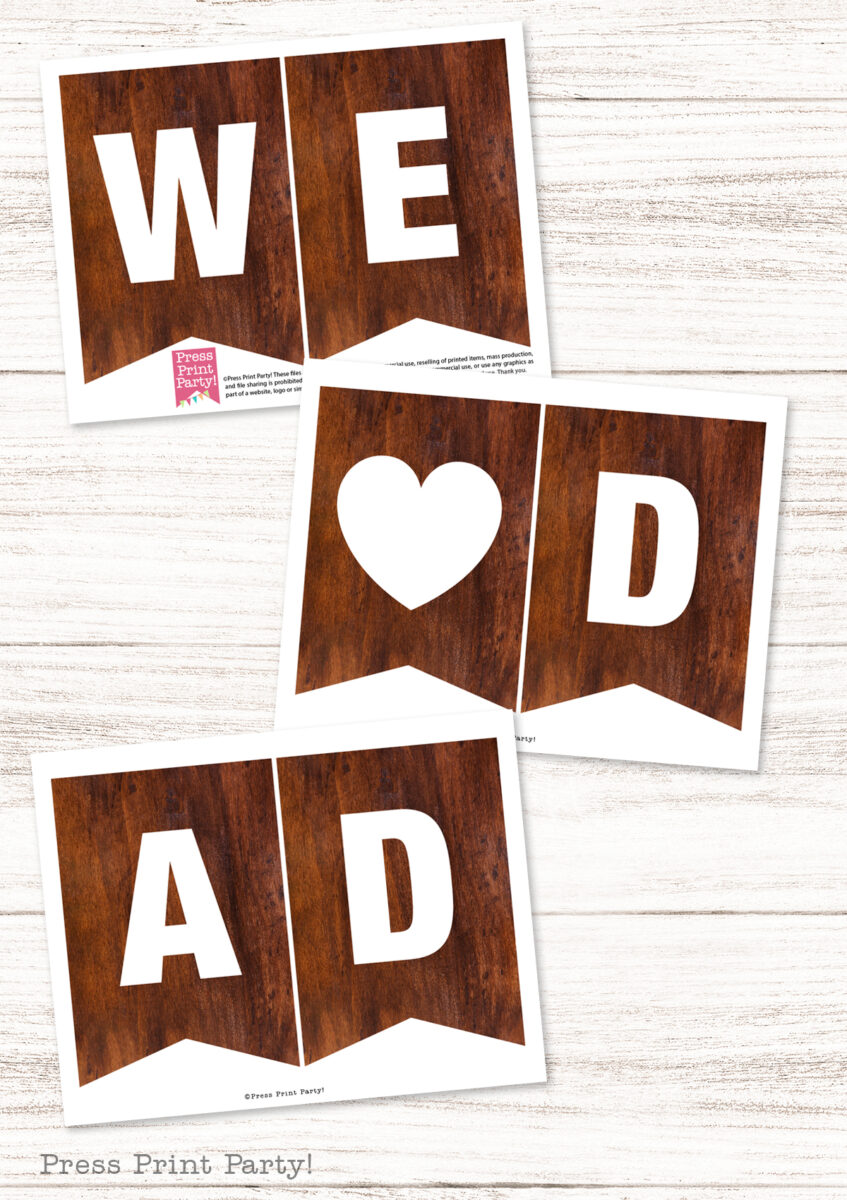 Three dark wood-texture pennant banners on a white wood background spell "WE ♥ DAD" in bold white letters, making this the perfect Father's Day banner to show your love, with a heart symbol replacing the word "love.