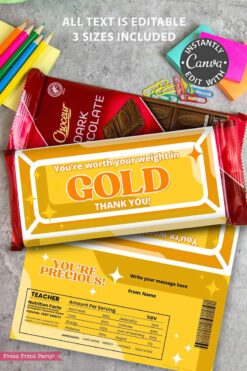 A flat lay displays the Thank You Chocolate Bar Wrap - Gold Bar, a teacher appreciation card, a red chocolate bar, and colorful paper clips and pens on a wooden surface.