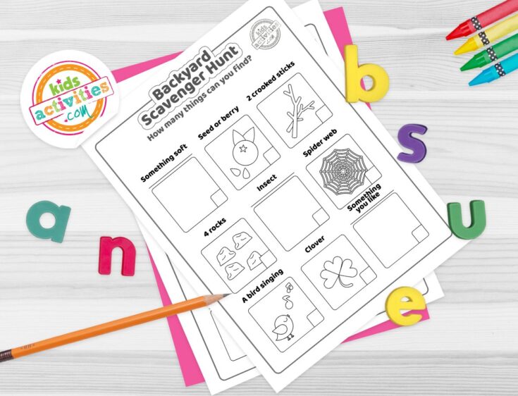 A backyard scavenger hunt worksheet with illustrations of items to find, colored pencils, a pencil, and foam letters on a white wooden surface. A Kids Activities logo is in the corner.