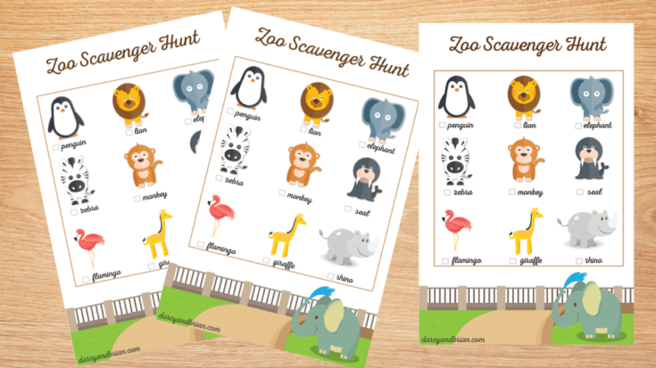 Three identical "Zoo Scavenger Hunt" sheets with cartoon animals—penguin, lion, elephant, zebra, monkey, seal, flamingo, and giraffe—with checkboxes beside each, displayed on a wooden surface.