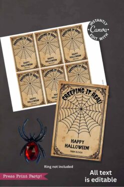 The Cute Ghost Halloween Gift Card Holder features printable vintage-style labels reading "Creeping It Real, Happy Halloween! From Olivia" with a ghost and spider web. Black plastic spider ring beside holder for display only; ring not included.