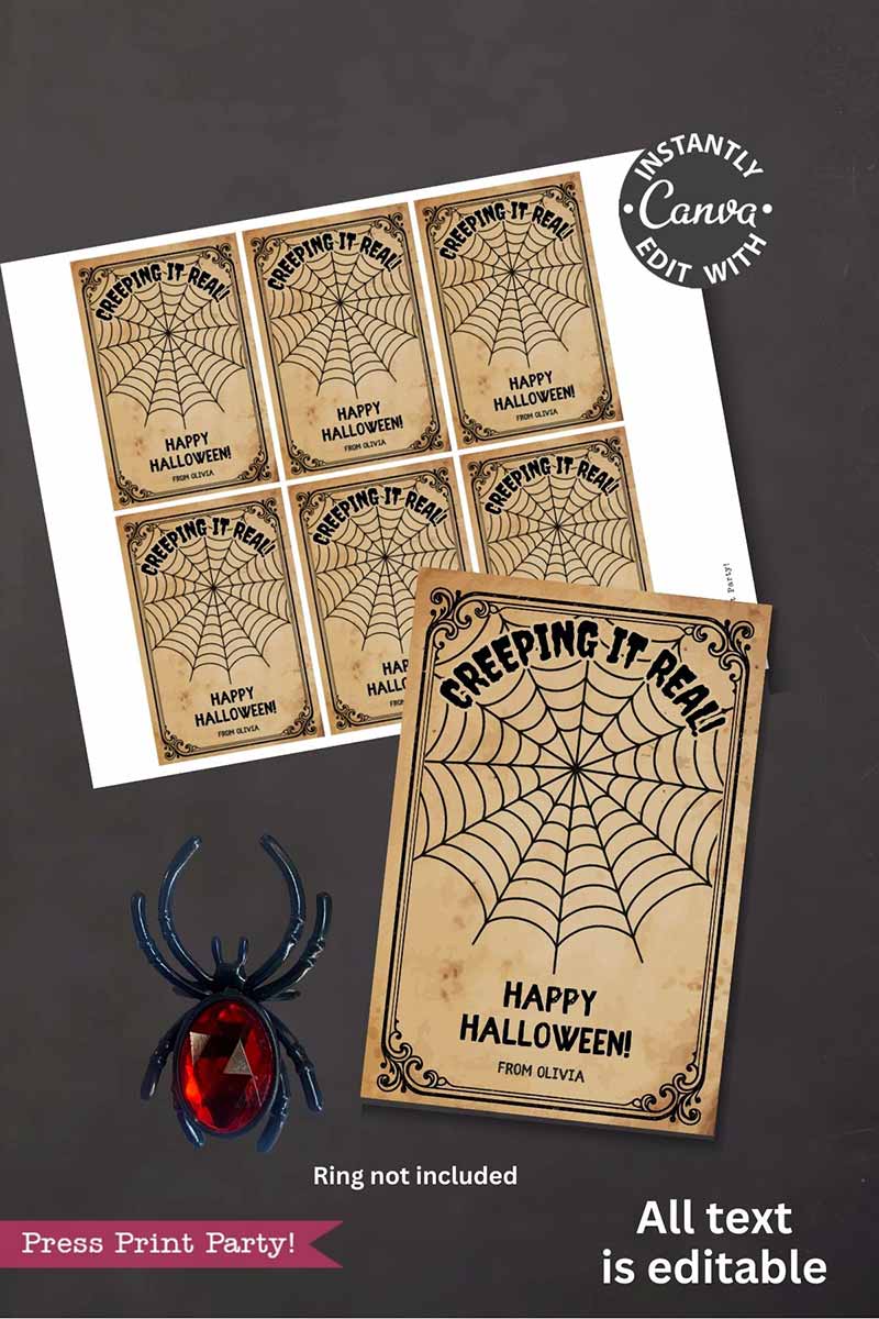The Cute Ghost Halloween Gift Card Holder features printable vintage-style labels reading "Creeping It Real, Happy Halloween! From Olivia" with a ghost and spider web. Black plastic spider ring beside holder for display only; ring not included.