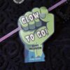 A Cute Ghost Halloween Gift Card Holder features a green cartoon fist holding a βGlow To Go! Happy Halloween! From Caluinβ sign, attached to a glow stick. Instantly edit with Canvaβall text is editable.