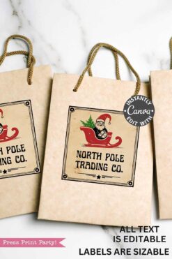 A brown paper gift bag with rope handles features a Vintage Christmas Stickers Printable - Set 1 label of Santa in a red sleigh, reading